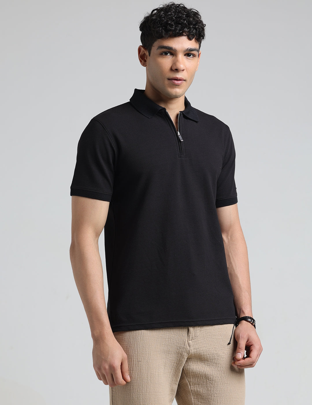 IDENTITI Men Slim Fit Polo Collar Solid T-Shirt In Black.