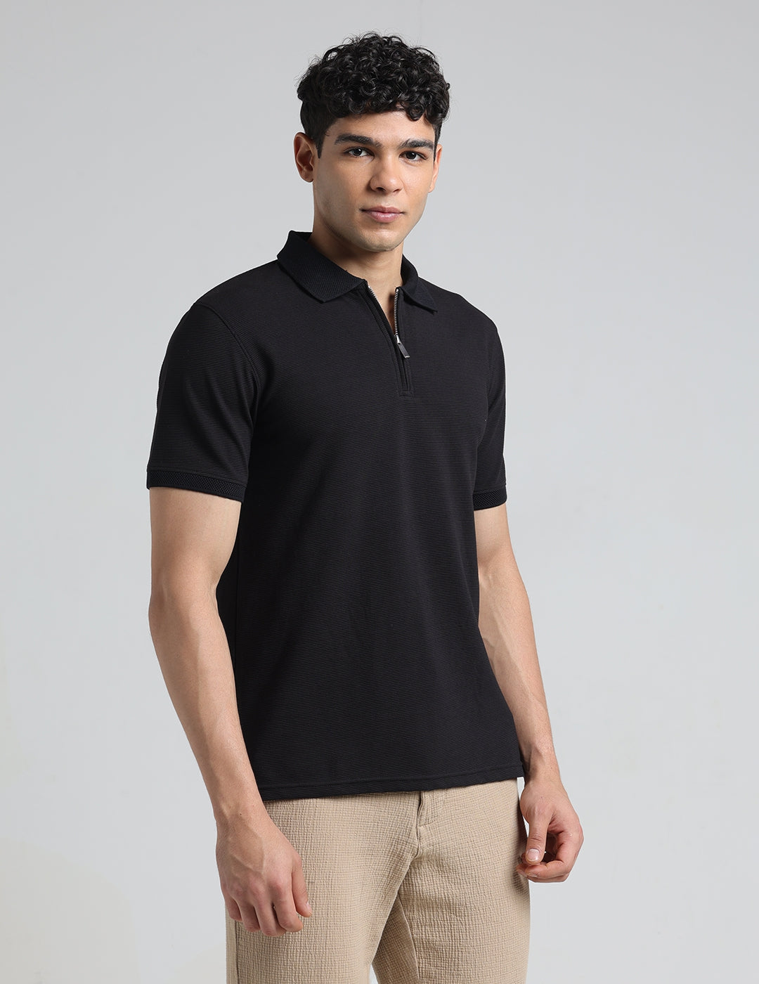 IDENTITI Men Slim Fit Polo Collar Solid T-Shirt In Black.